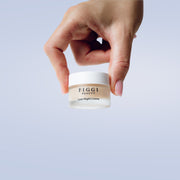 Hands holding FIGGI Mini Luxe Night Crème for an evening Green Rooibos skincare ritual